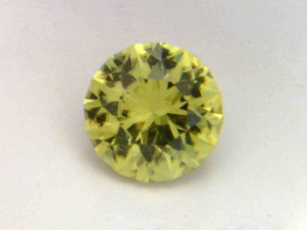 Stone: Golden Tourmaline<br />Price: 475$ + доставка <br />Weight: 3,16 cts<br />Clarity: VVS <br />Dimensions: 9.18x 9.13x 6.29mm <br />Design: Round Brilliant<br />Origin: Tanzania<br />Treatment: None<br /><br />Notes: This is a golden tourmaline from  Tanzania. It is yellow/golden color. Clean and bright.  This stone will please anyone who loves a nice yellow stone.